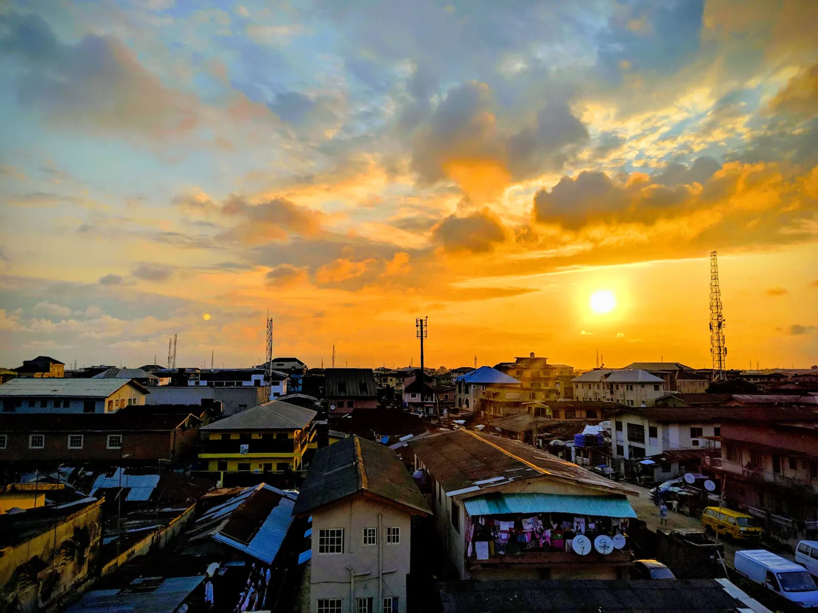 Rooftops of a Lagos neighbourhood at sunset.